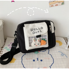 Сумка Korni через плече Hello Girl підліткова зі значками тканинна корейська стиль 21x5.5x16 чорно-біла (SVS) Сумка Korni через плече Hello Girl підліткова зі значками тканинна корейська стиль 21x5.5x16 чорно-біла (SVS)